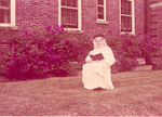 Sister Gonzaga Greene, O.P., reading the Bible outdoors